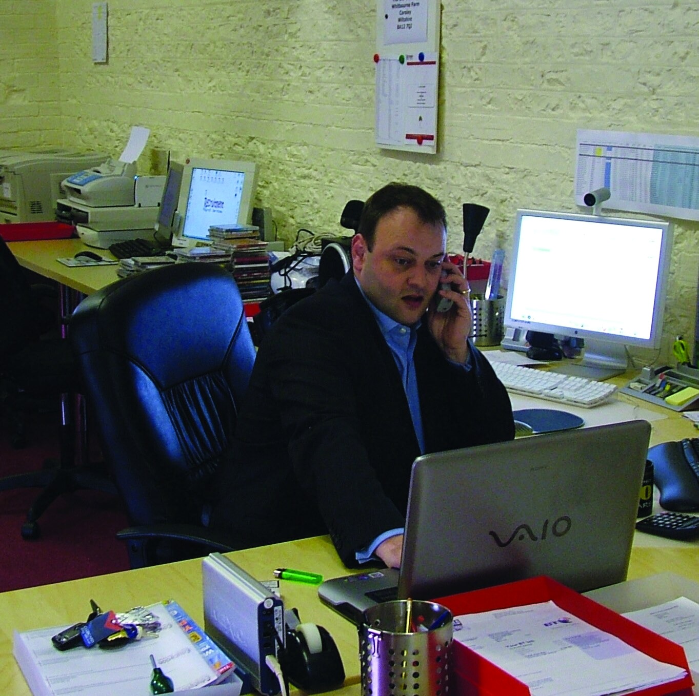 Terence Hillier working in an early company office